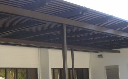 Custom-made awning adorning the outside of a business building.